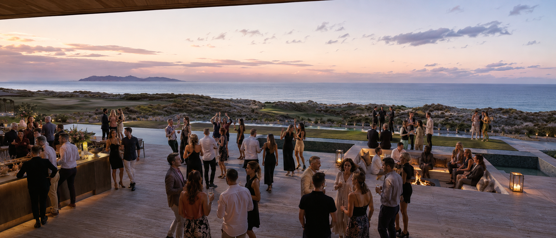 Guests on the terrace of the Te Arai house at sunset, overlooking the pool, golf links and ocean