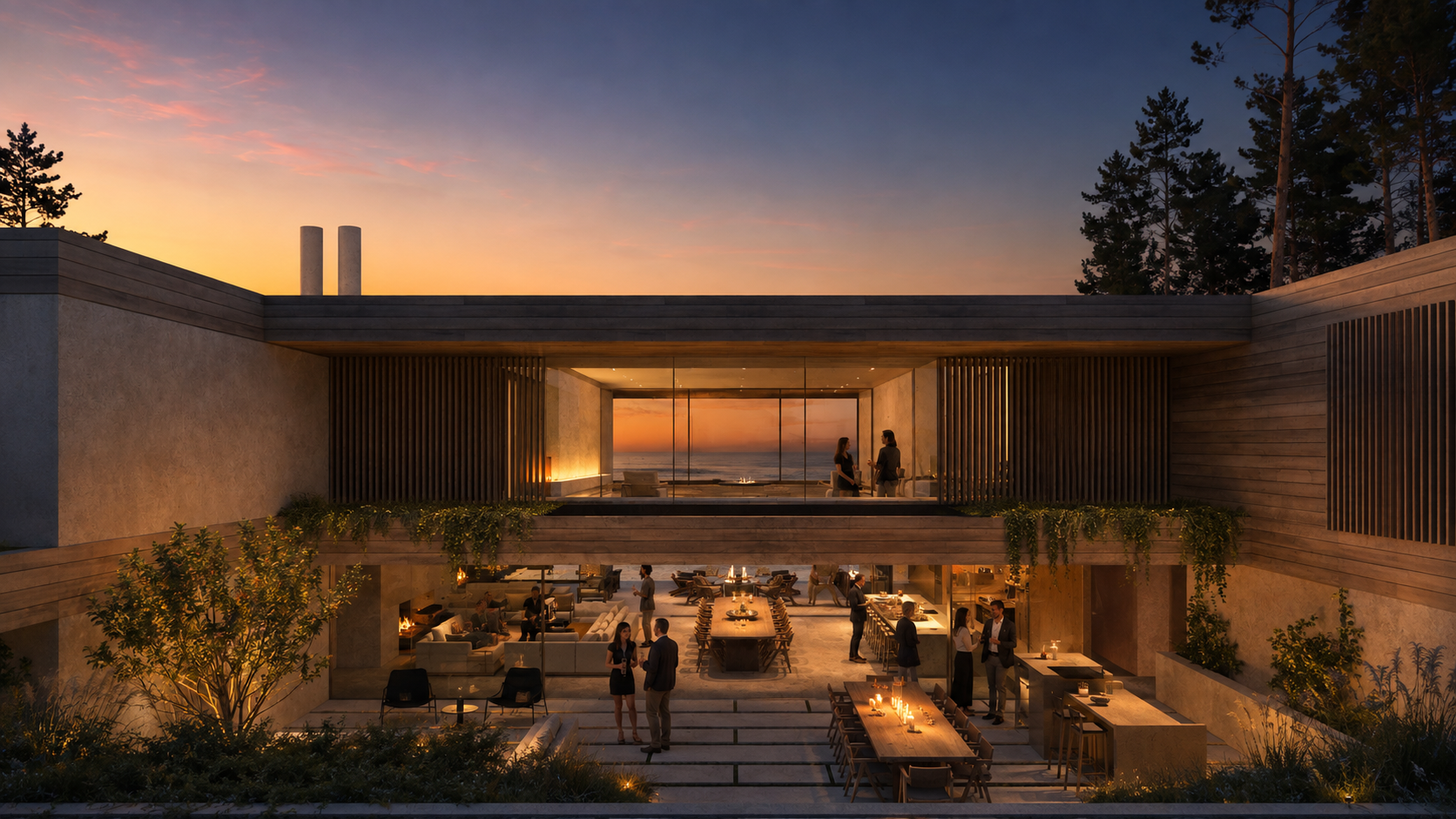 The Te Arai house at dusk, guests gathered around the long table by the sea